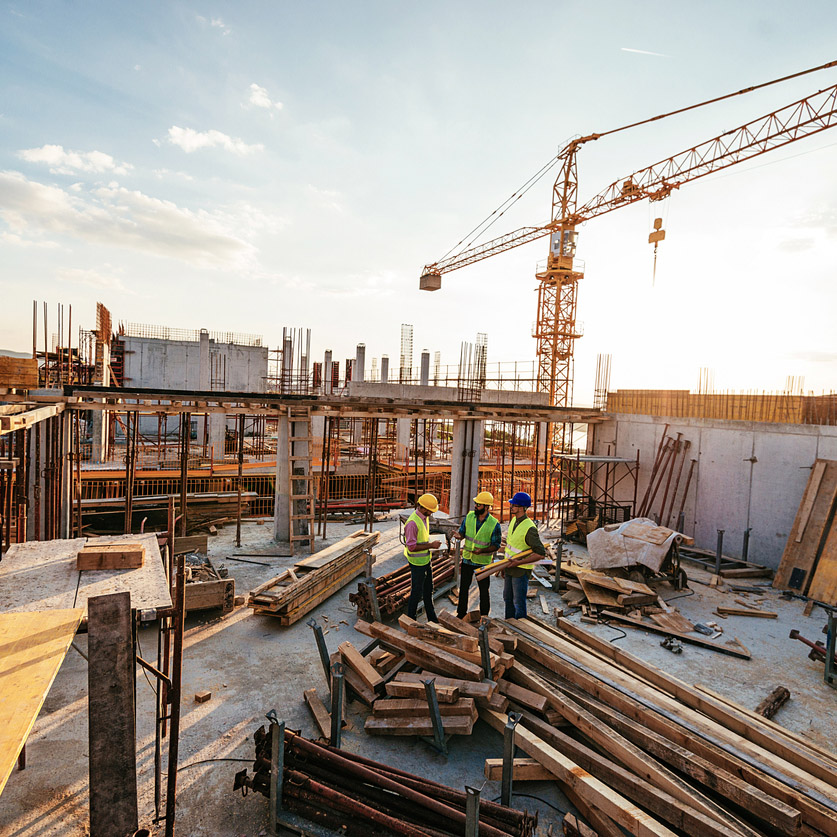 Investors and contractors on construction site